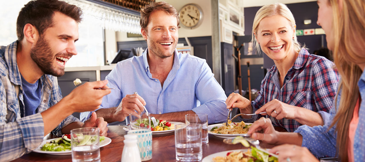 group of four dining in restaurant